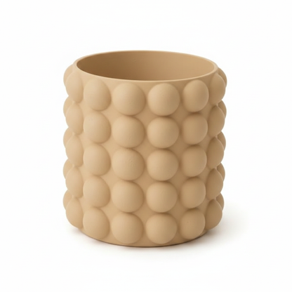 Tan bubble texture pot on white background