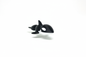 3D printed baby orca figurine on white background