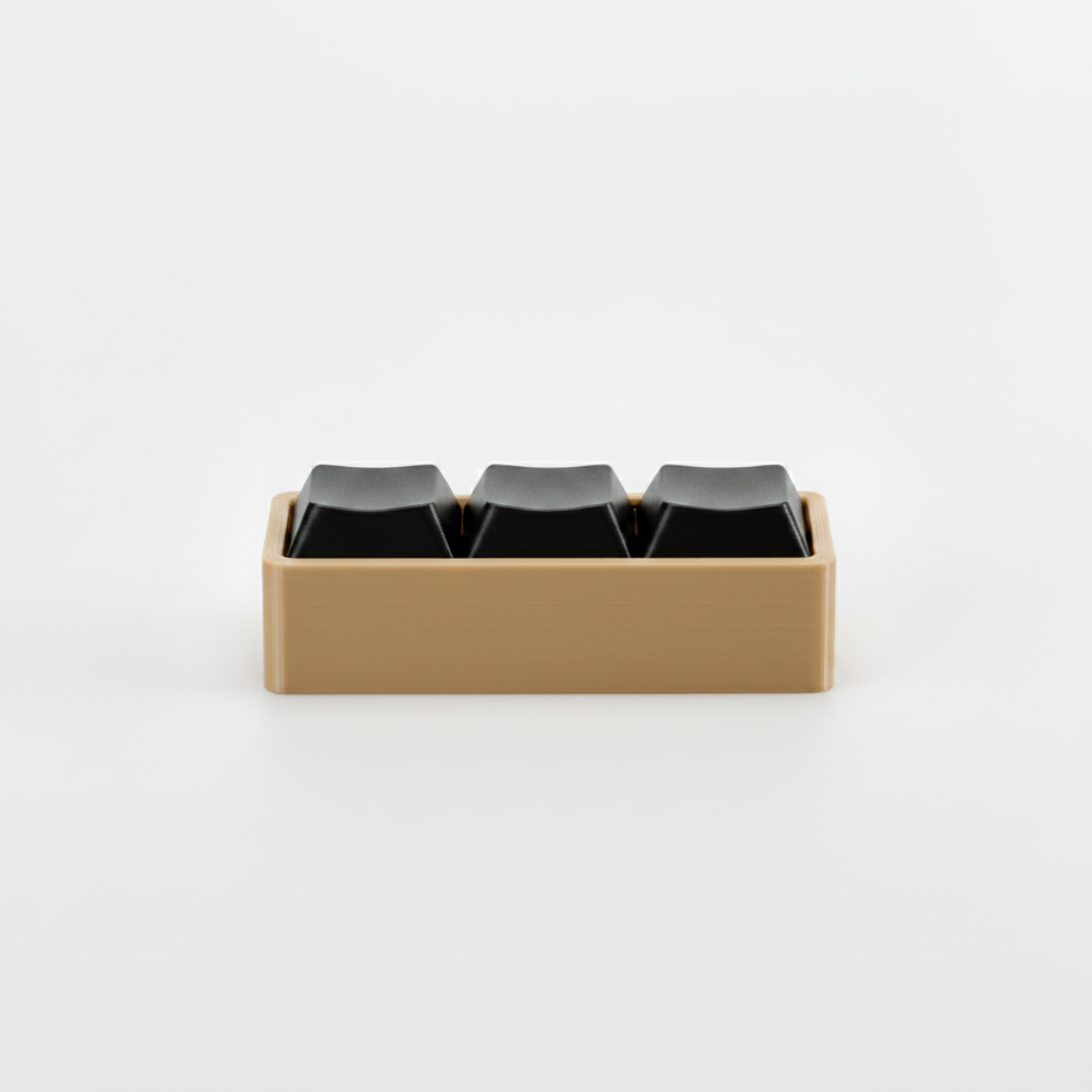 3D printed fidget macro pad with tan base and black keycap buttons on gray background
