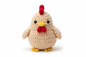 Crocheted chicken stuffed animal on white background