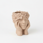 Ceramic face planter with flower crown and hands, tan color on white background