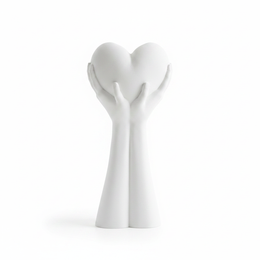 White 3D printed hands holding a heart sculpture on white background