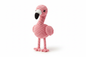 Crocheted pink flamingo stuffed animal on white background