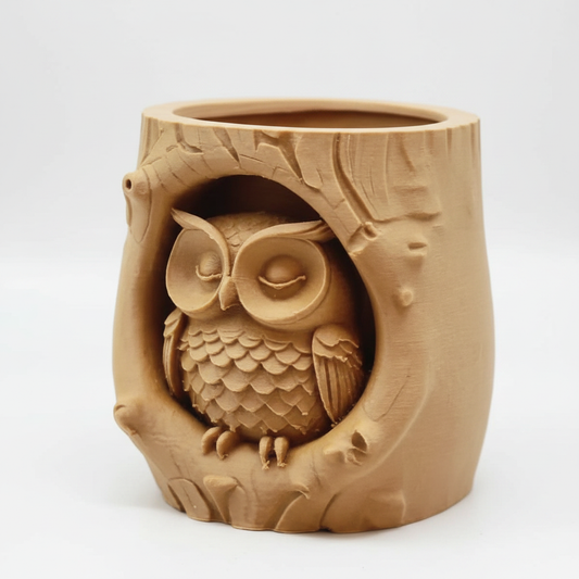 Tan ceramic owl tree stump planter on white background